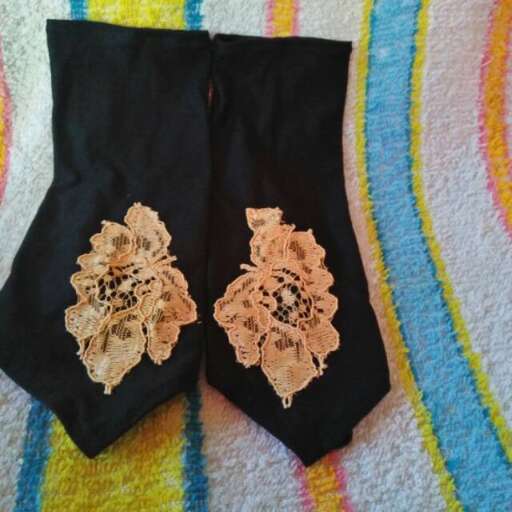 a pair of black silk scarf with laces