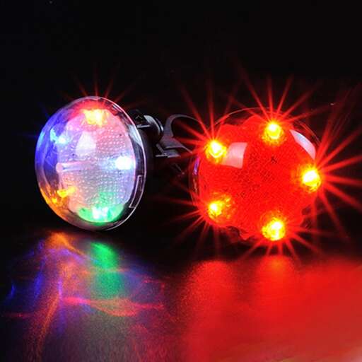 two balls of christmas lights, one with a red and green tint.