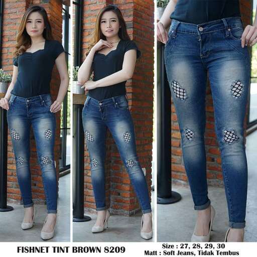 a girl in a black top and jeans