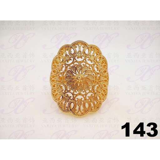 a gold ring with a flower design.