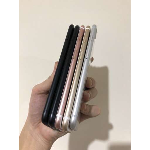 a hand holding a cell phone in a case.