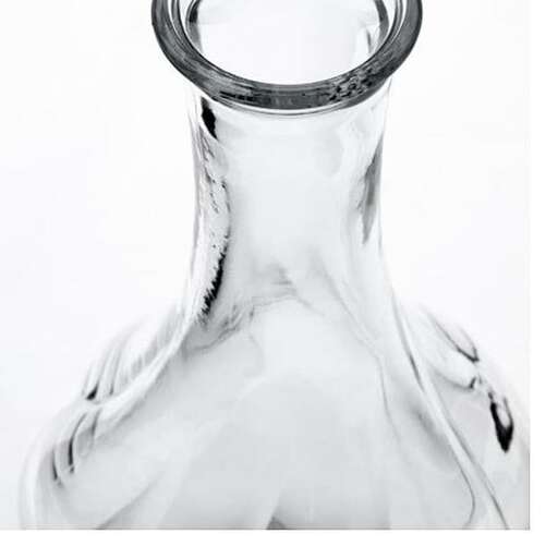 a glass vase with a ring on it.