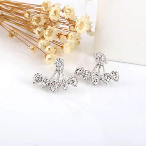 a set of sterling silver earrings with diamonds