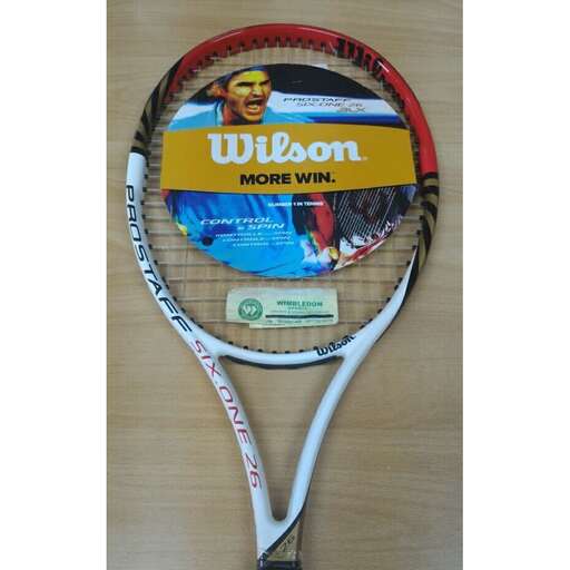 a tennis racket with a picture of a man on it.