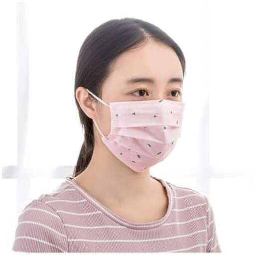 a woman wearing a face mask with a face mask on her face