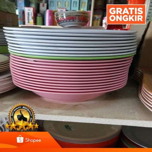 a stack of plates on a shelf in a store.
