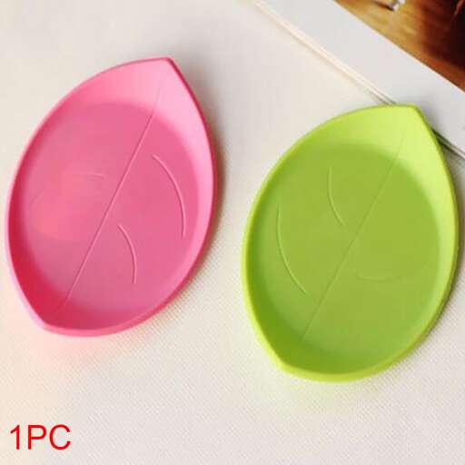 a pink and green plate with a broken heart on it.