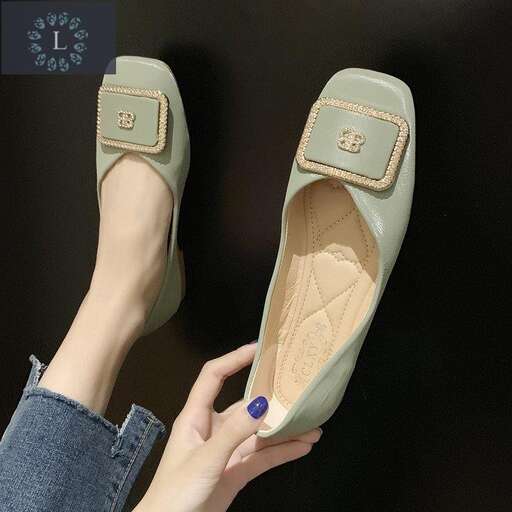 a pair of sandals with a nail polish on the toe.