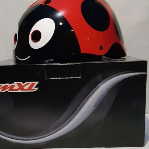 a red and black helmet sitting on top of a box.