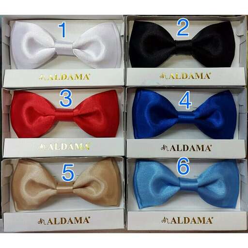 a box of four bow ties with a blue bow tie.