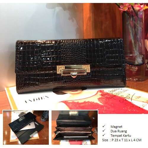 a purse with a small handle on a table.