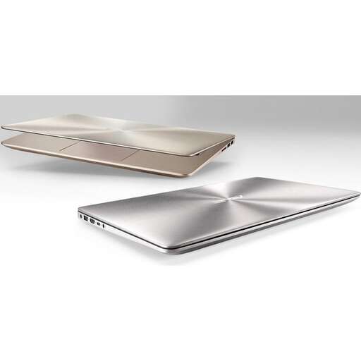 a silver laptop with a silver cover and a glass tray on top.