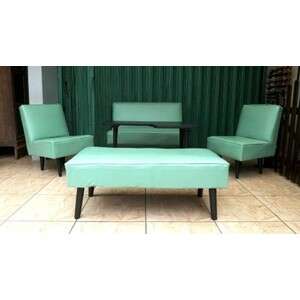 a green couch and two chairs in a room.