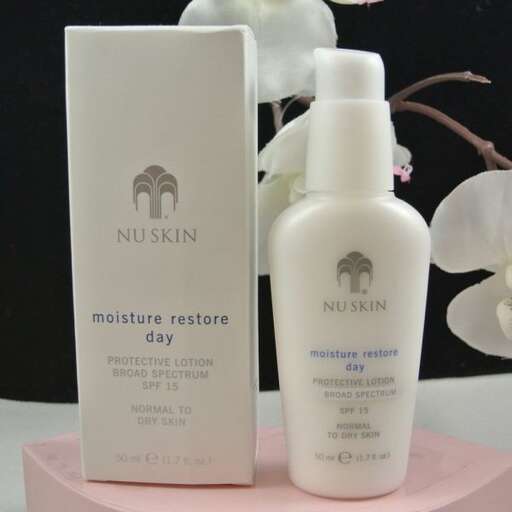 a bottle of shampoo and lotion on a pink base.