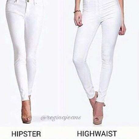 a pair of white jeans with a black belt