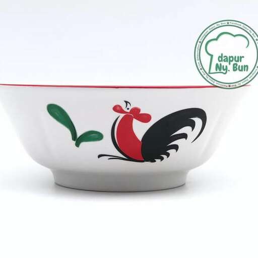 a bowl of food with a rooster on it.