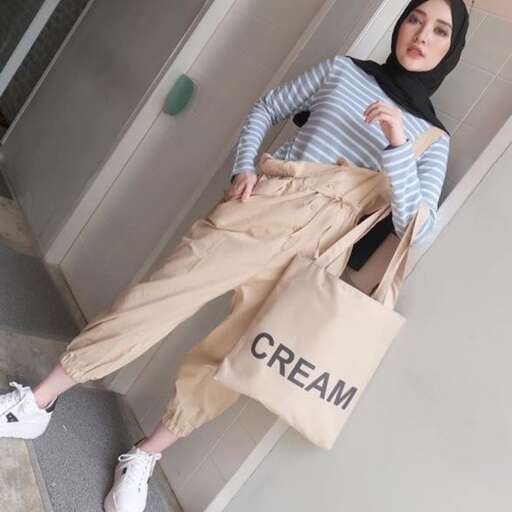 i love the way the girl is wearing the striped shirt and trousers.