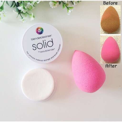 a pink, yellow, and white soap in a container.