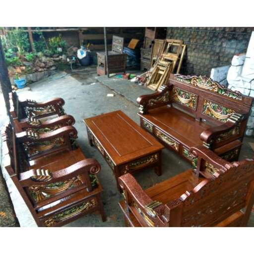 a collection of chairs in a workshop.