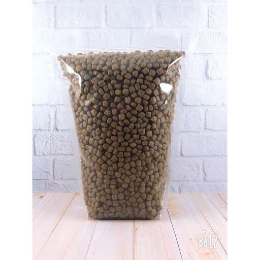 a large vase filled with lots of green seeds