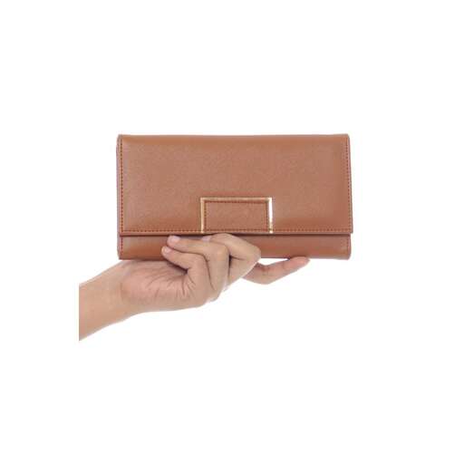 a hand holding a brown leather wallet on a white background