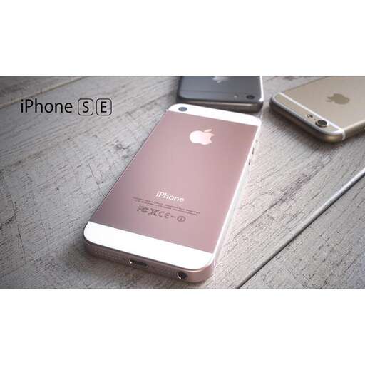 a white iphone sitting on a wooden table.