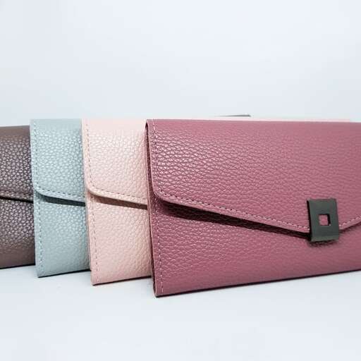 a group of different colored bags on display.