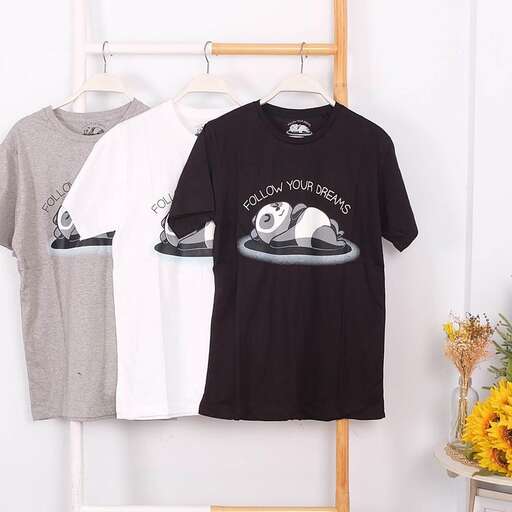 a black t - shirt with a picture of a boat on the front.