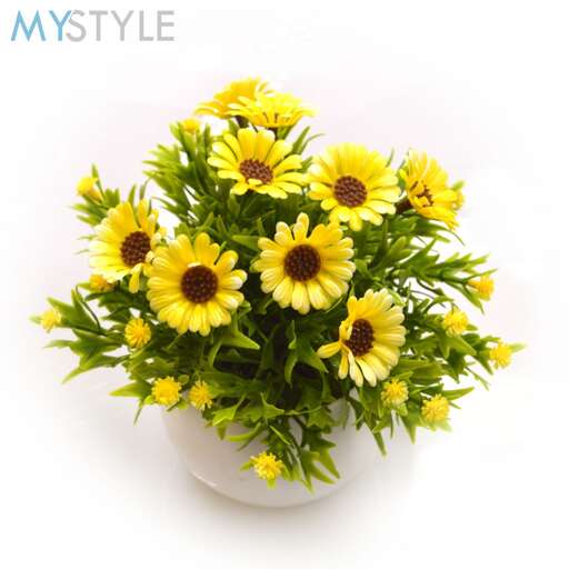a vase filled with yellow flowers on top of a white background.