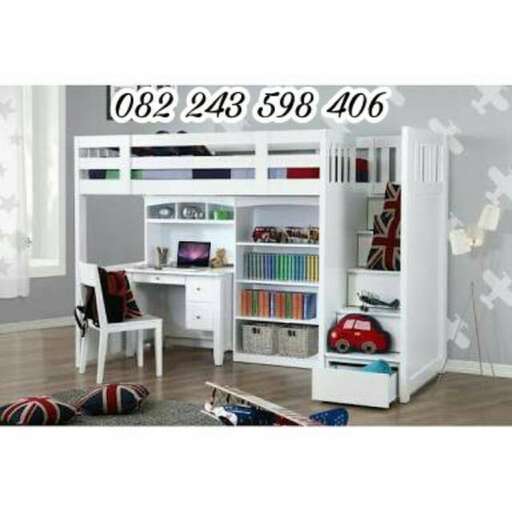 a desk with a computer and a chair.