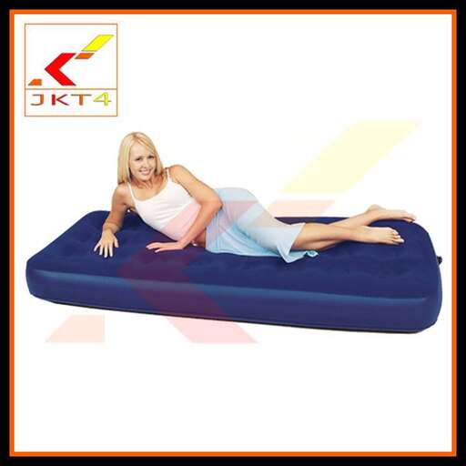 a woman on a blue mattress