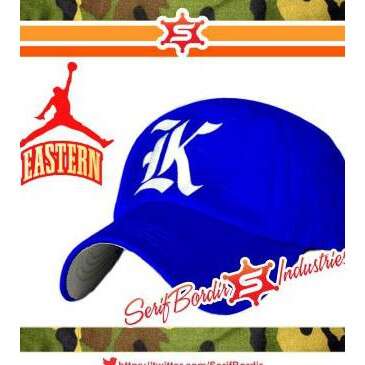 baseball cap with the letter k in the middle