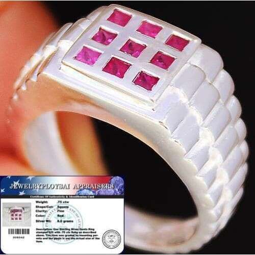 this ring is made of silver and has a square pattern on the inside.