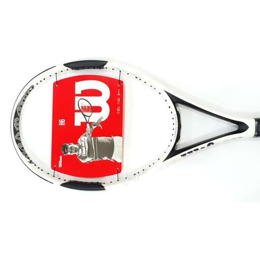 a tennis racket with a tennis ball on it.