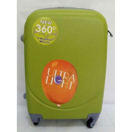a green suitcase with a sticker on it.