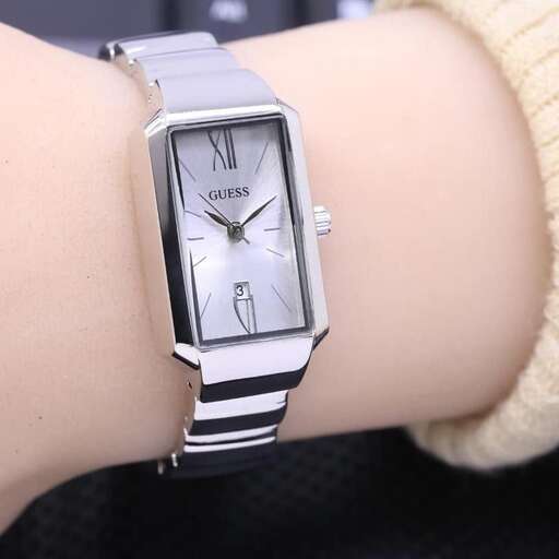 a woman with a watch on her wrist.