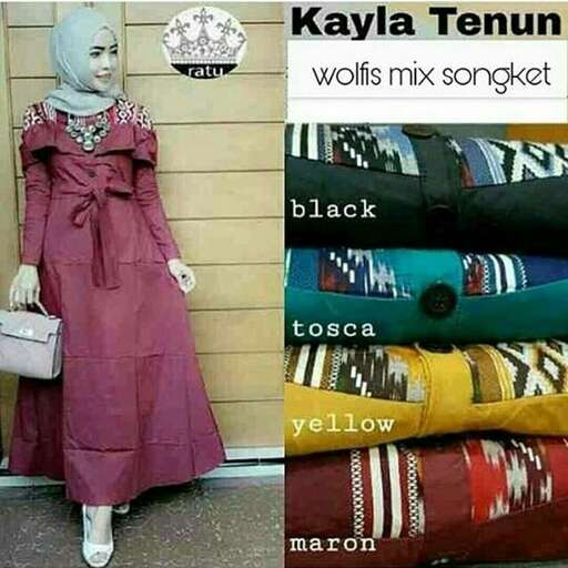 a woman in a dress and a bag