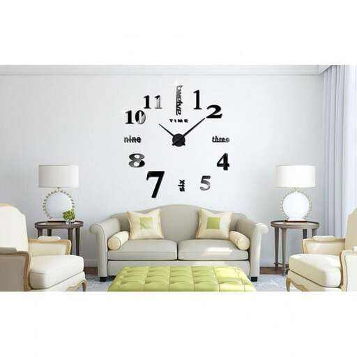 a clock on the wall above a couch.