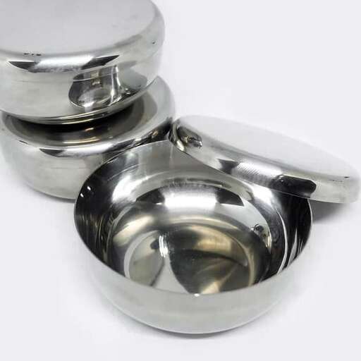 a silver bowl with a lid and a silver bowl.