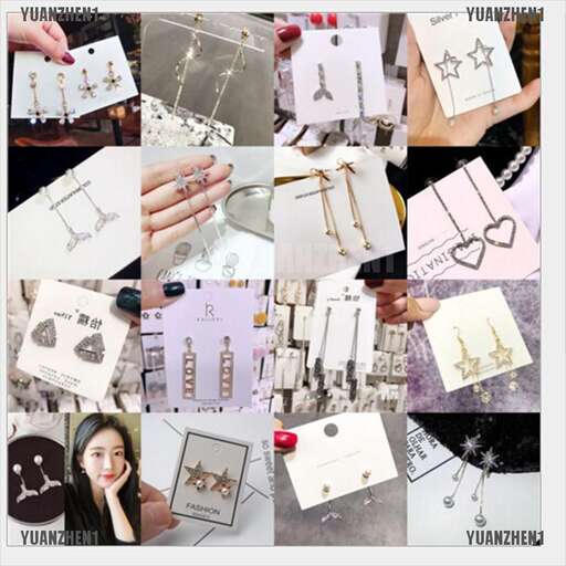 a woman is holding a box of cards.
