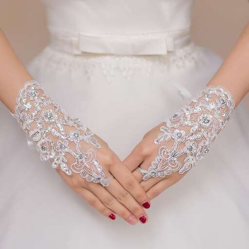 the brides are wearing a wedding dress with a hand - painted design.