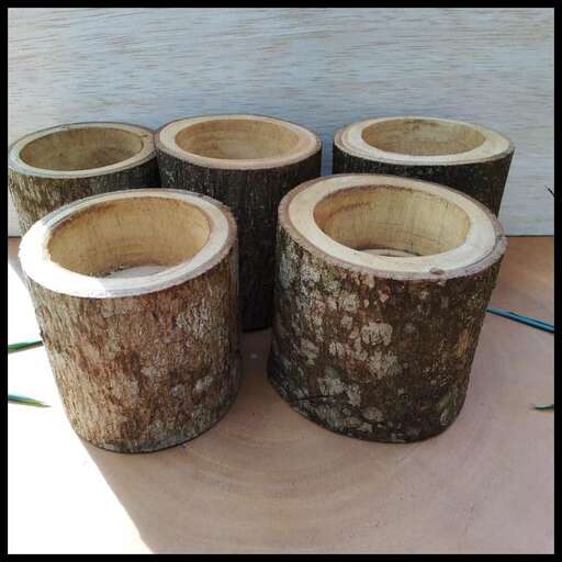 a group of wooden barrels sitting on a table.