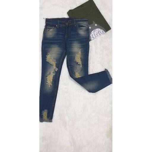 a pair of jeans with a torn front pocket.