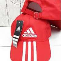 a bag with a red hat and a white and black logo.