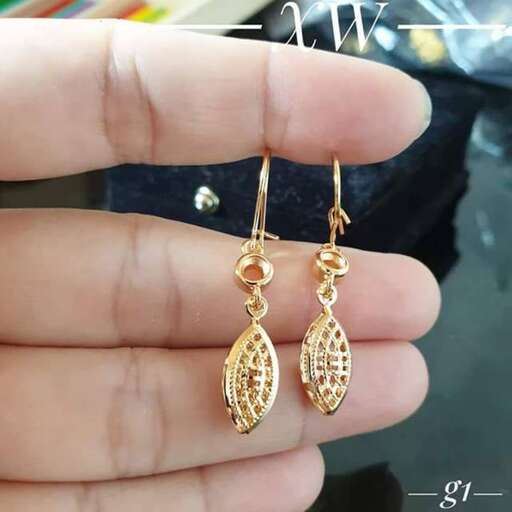 gold earrings with a diamond