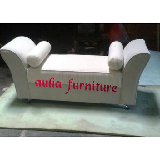 a chair made out of a white leather couch.