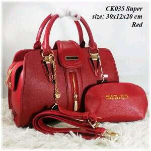 red bag with gold embroidery and a red bag