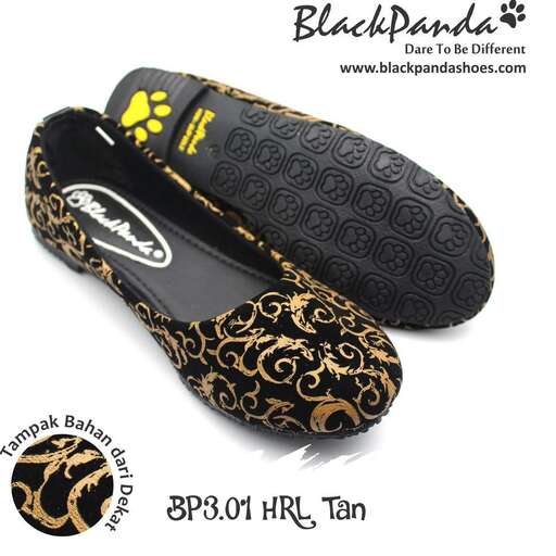 black and gold sandal by the sea
