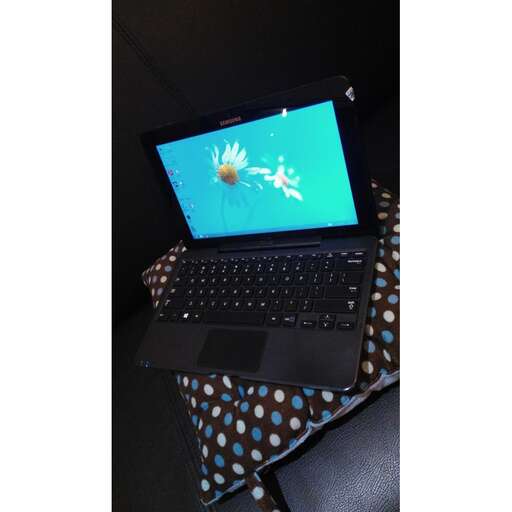 a laptop computer with a blue screen on it.