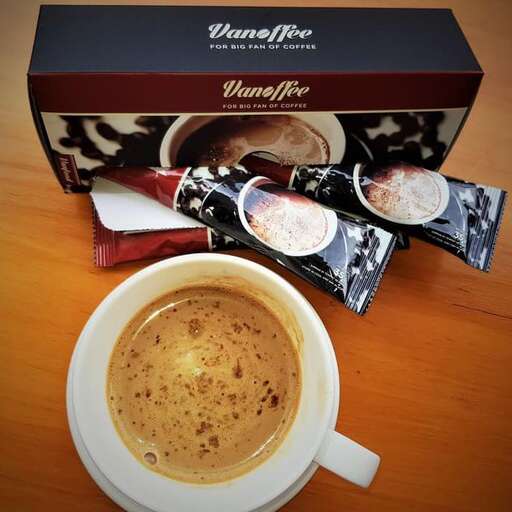 a cup of coffee and a box of chocolates